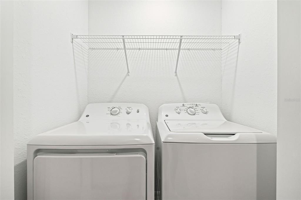 19140 Scallop Loop, Unit 105 Lakewood Ranch, FL 34211 - Photo 24 of 37 a utility room with dryer and washer