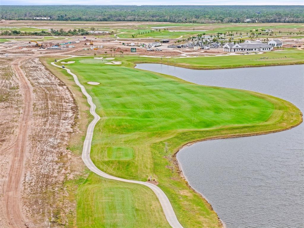 19140 Scallop Loop, Unit 105 Lakewood Ranch, FL 34211 - Photo 33 of 37 a view of a swimming pool and an ocean view