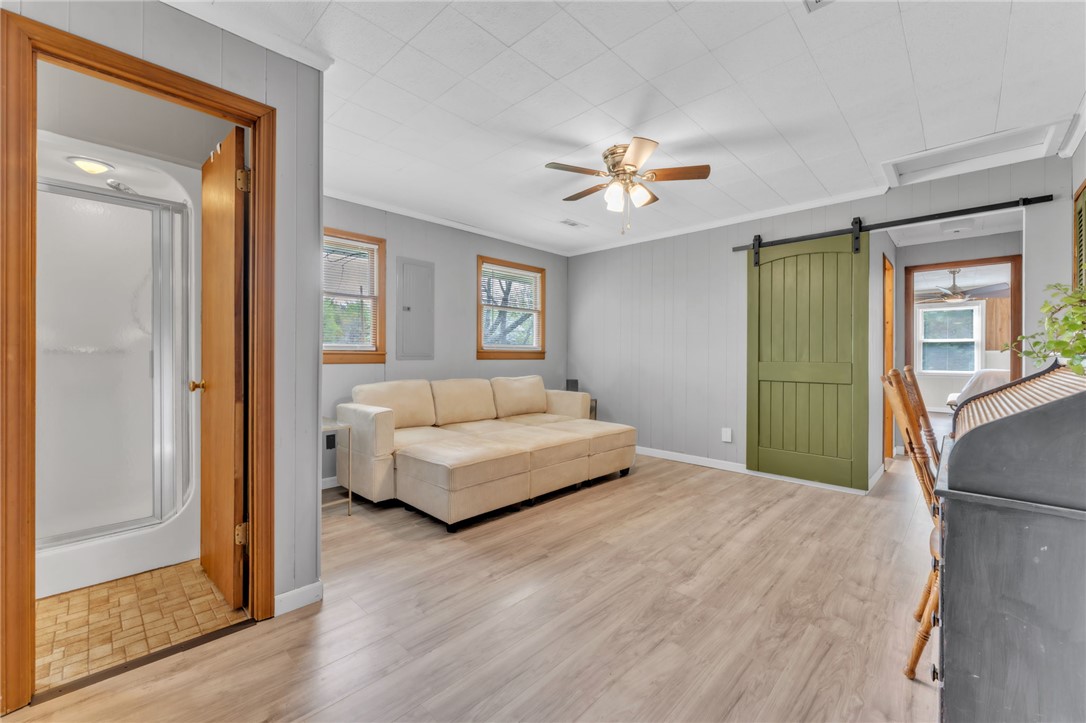 466 Whetstone Road Mountain Rest, SC 29664 - Photo 13 of 31 Bright and airy living space with warm wood floors and modern accents.