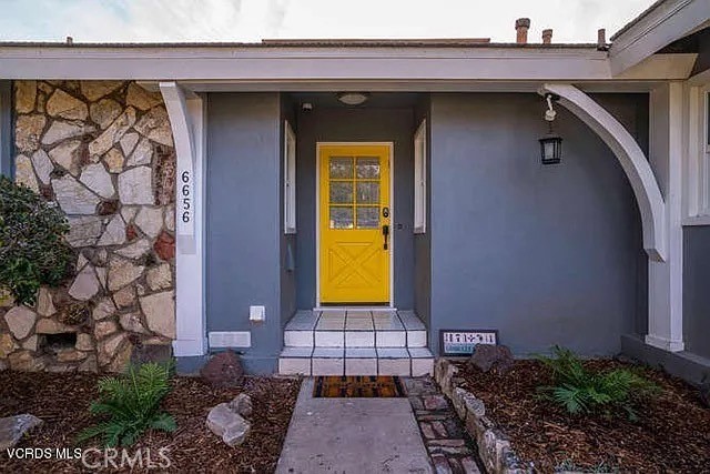 6656 Columbus Avenue Van Nuys, CA 91405 - Photo 12 of 21 a front view of a house with a garden
