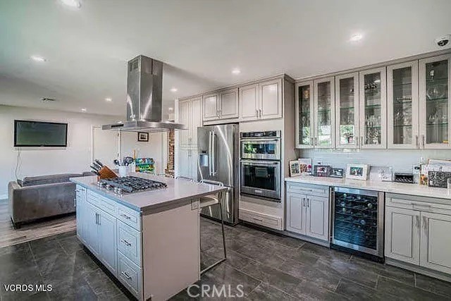 6656 Columbus Avenue Van Nuys, CA 91405 - Photo 3 of 21 a kitchen with stainless steel appliances granite countertop a stove and a sink