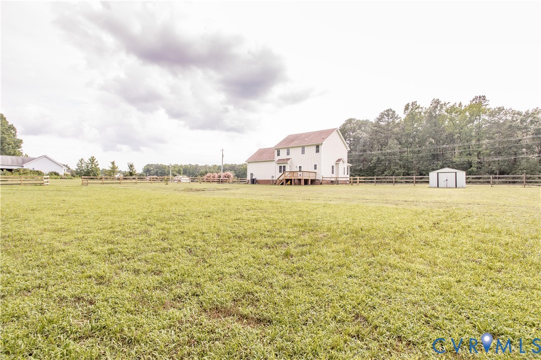 20411 Horseshoe Road Carson, VA 23830 - Photo 10 of 35 Expansive green lawn with a two-story residence fe