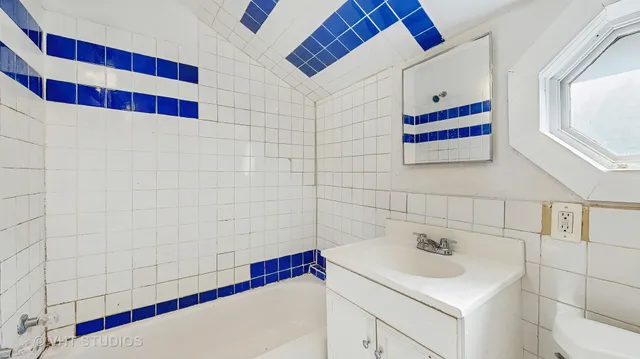 a bathroom with a sink and a bathtub