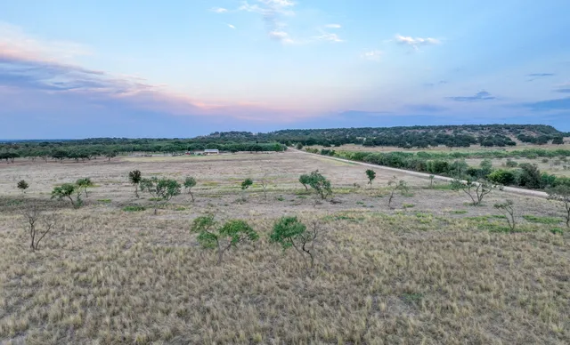 a view of a lake with houses in the back