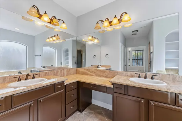 a bathroom with a sink double vanity and a mirror