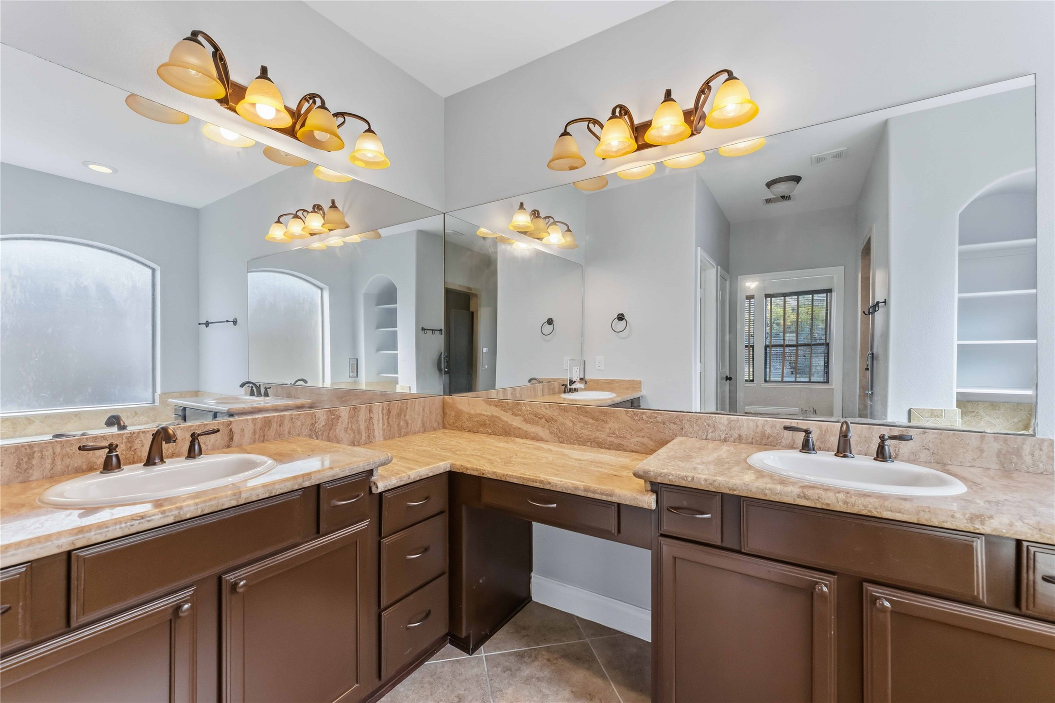 25327 Oak Knot Drive Spring, TX 77389 - Photo 16 of 32 a bathroom with a sink double vanity and a mirror