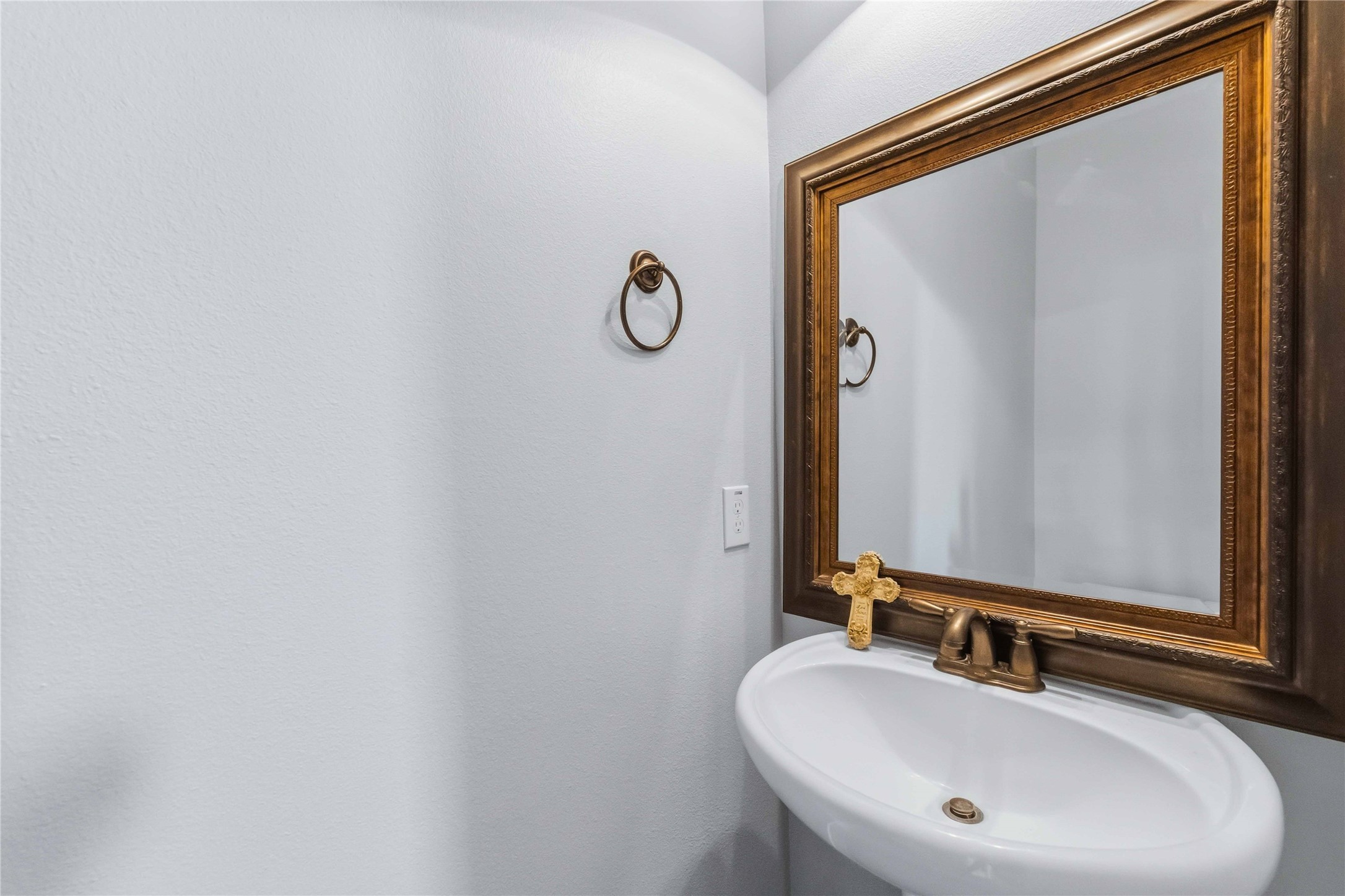 25327 Oak Knot Drive Spring, TX 77389 - Photo 21 of 32 a bathroom with a sink and a mirror