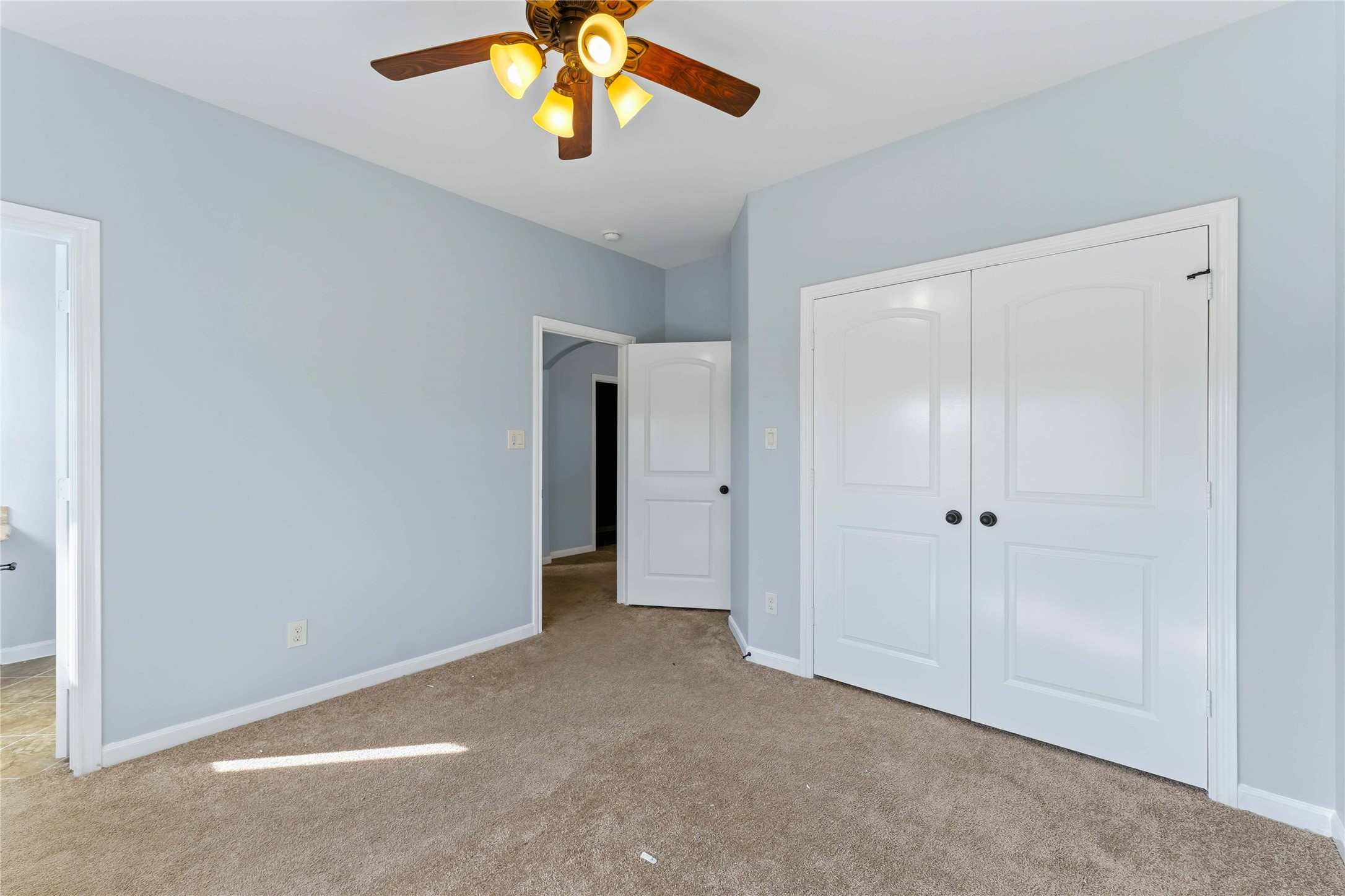 25327 Oak Knot Drive Spring, TX 77389 - Photo 29 of 32 an empty room with a empty space and a ceiling fan