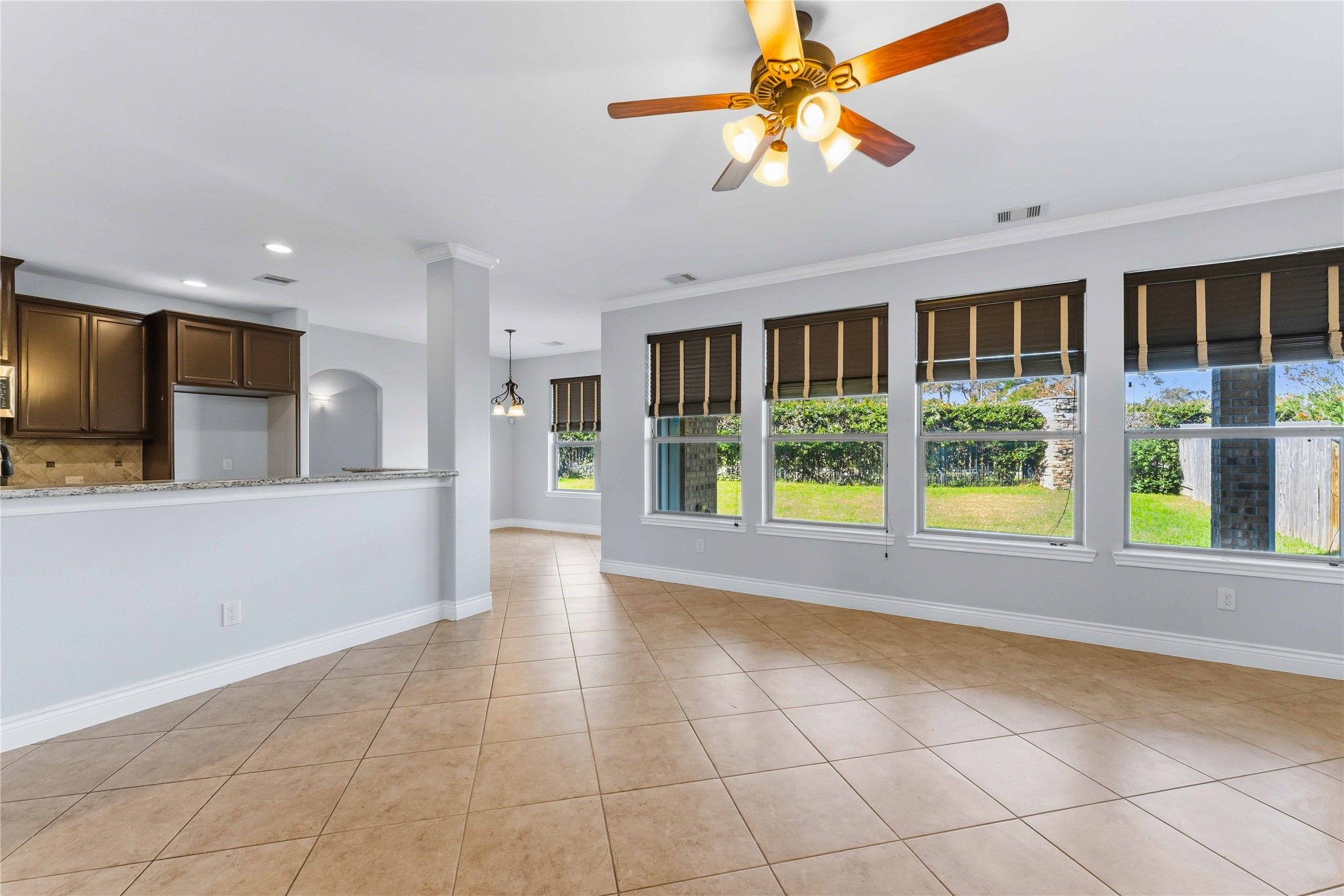 25327 Oak Knot Drive Spring, TX 77389 - Photo 7 of 32 a view of an empty room with window and kitchen view