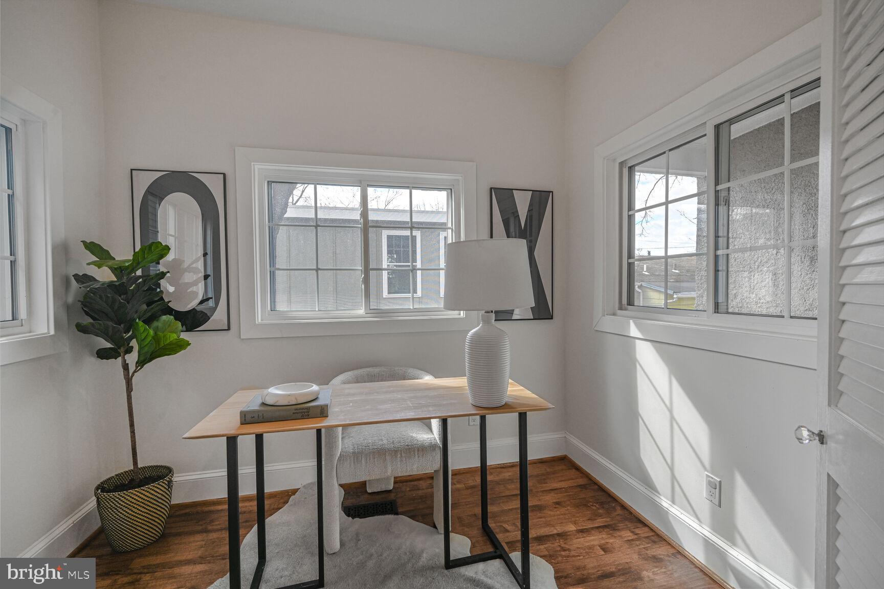 3410 Morrison Street Northwest Washington, DC 20015 - Photo 22 of 71 a workspace with furniture and a potted plant