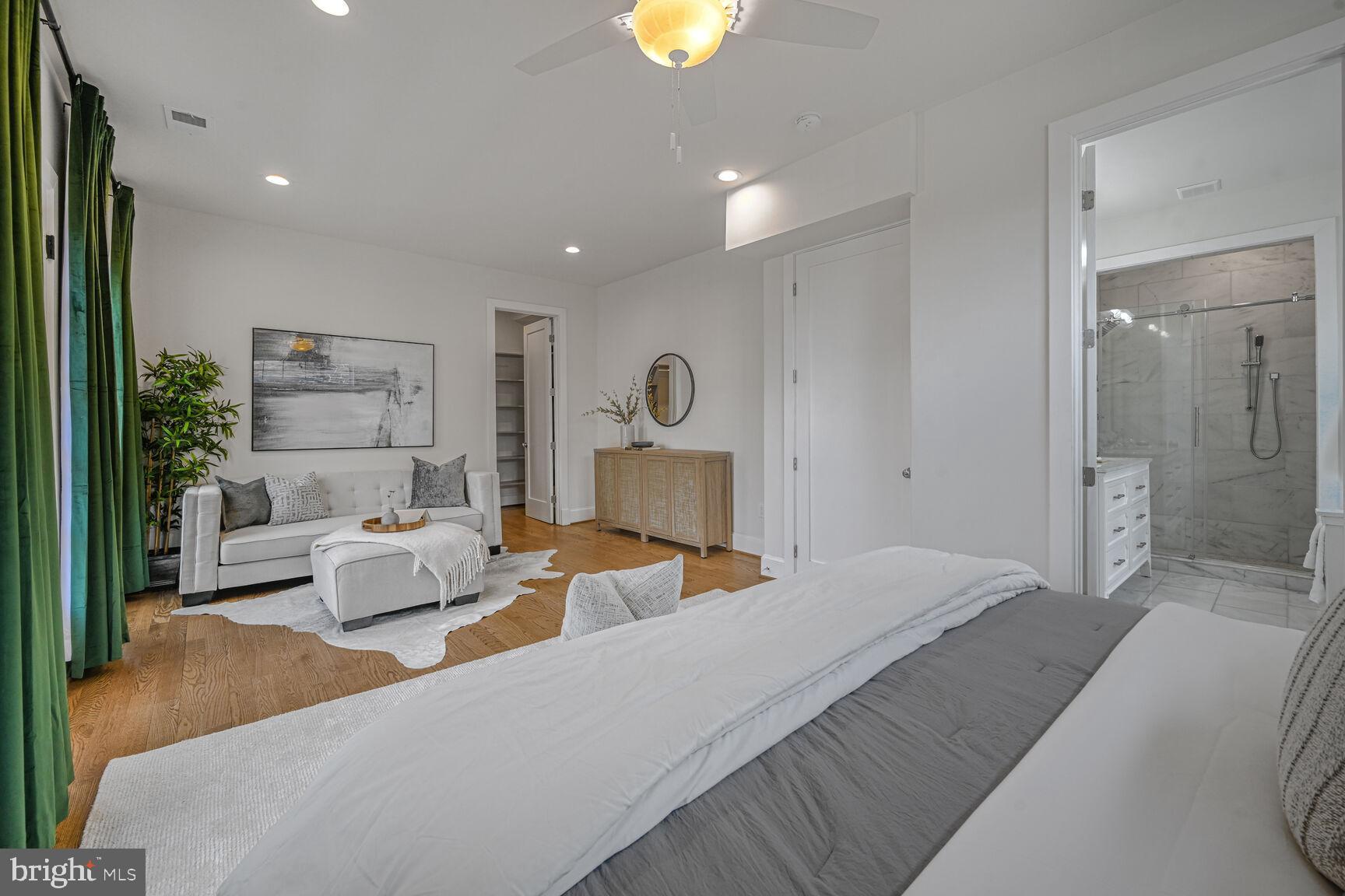 3410 Morrison Street Northwest Washington, DC 20015 - Photo 25 of 71 a bedroom with a bed and a chandelier