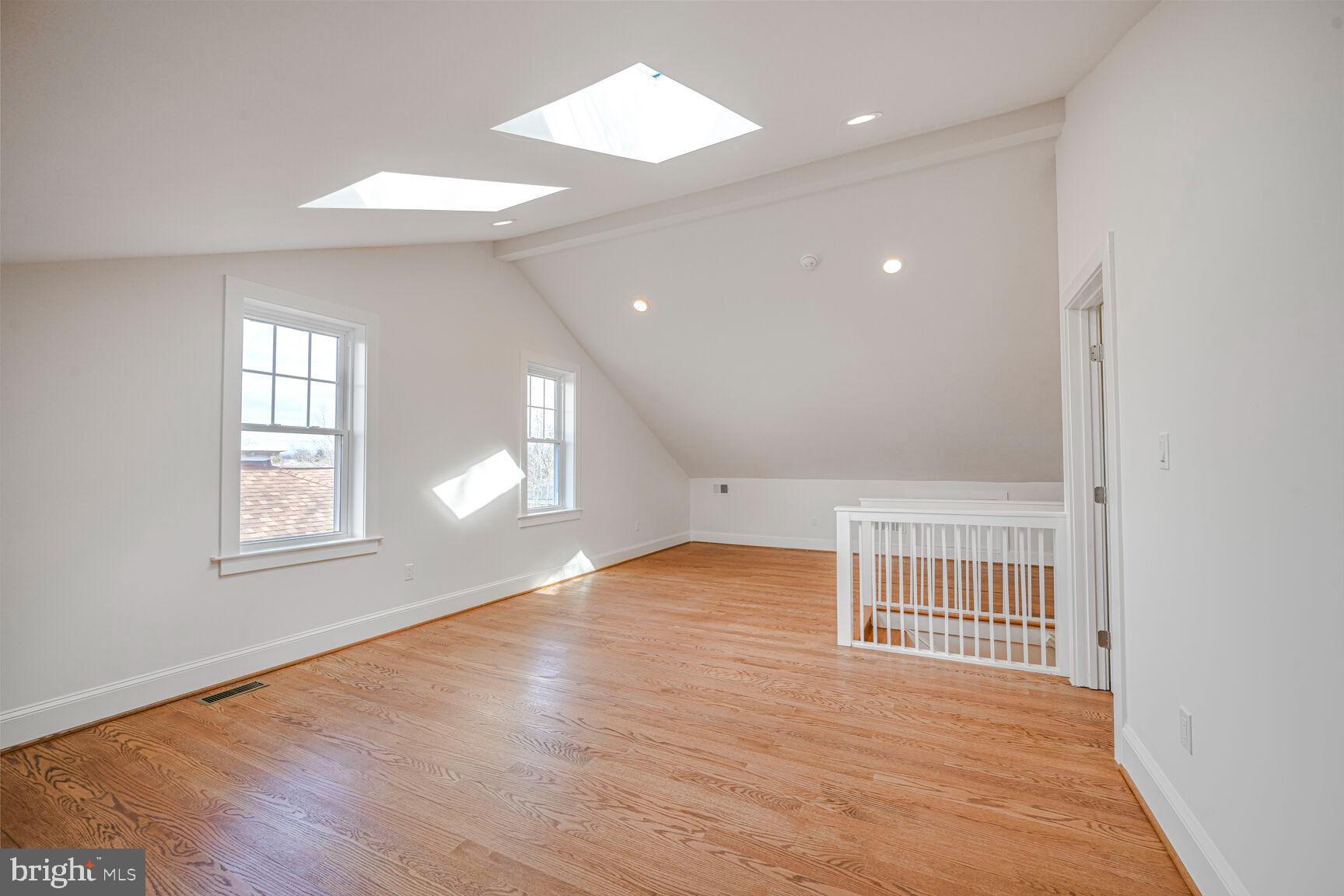 3410 Morrison Street Northwest Washington, DC 20015 - Photo 37 of 71 an empty room with wooden floor and windows