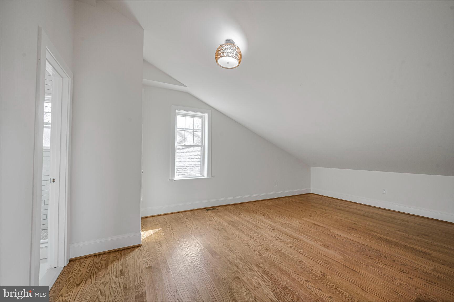3410 Morrison Street Northwest Washington, DC 20015 - Photo 38 of 71 an empty room with wooden floor and windows