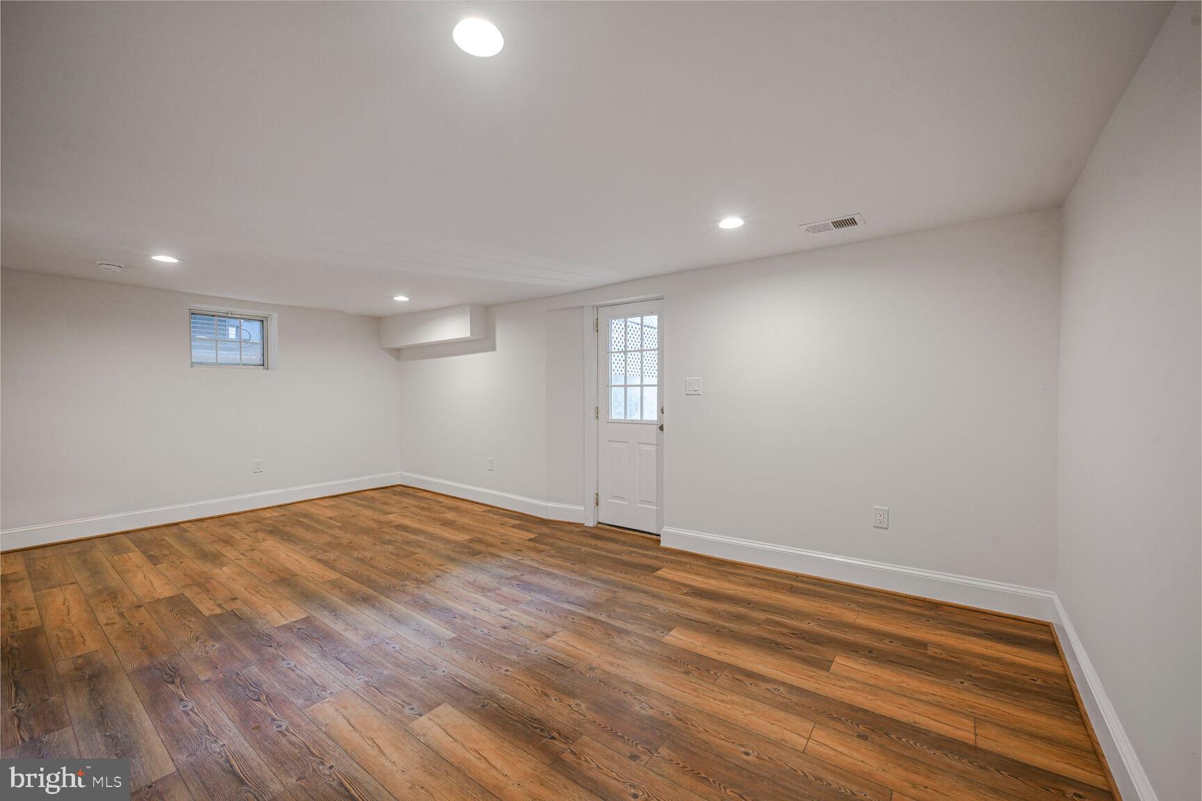 3410 Morrison Street Northwest Washington, DC 20015 - Photo 42 of 71 a view of empty room with wooden floor and fan
