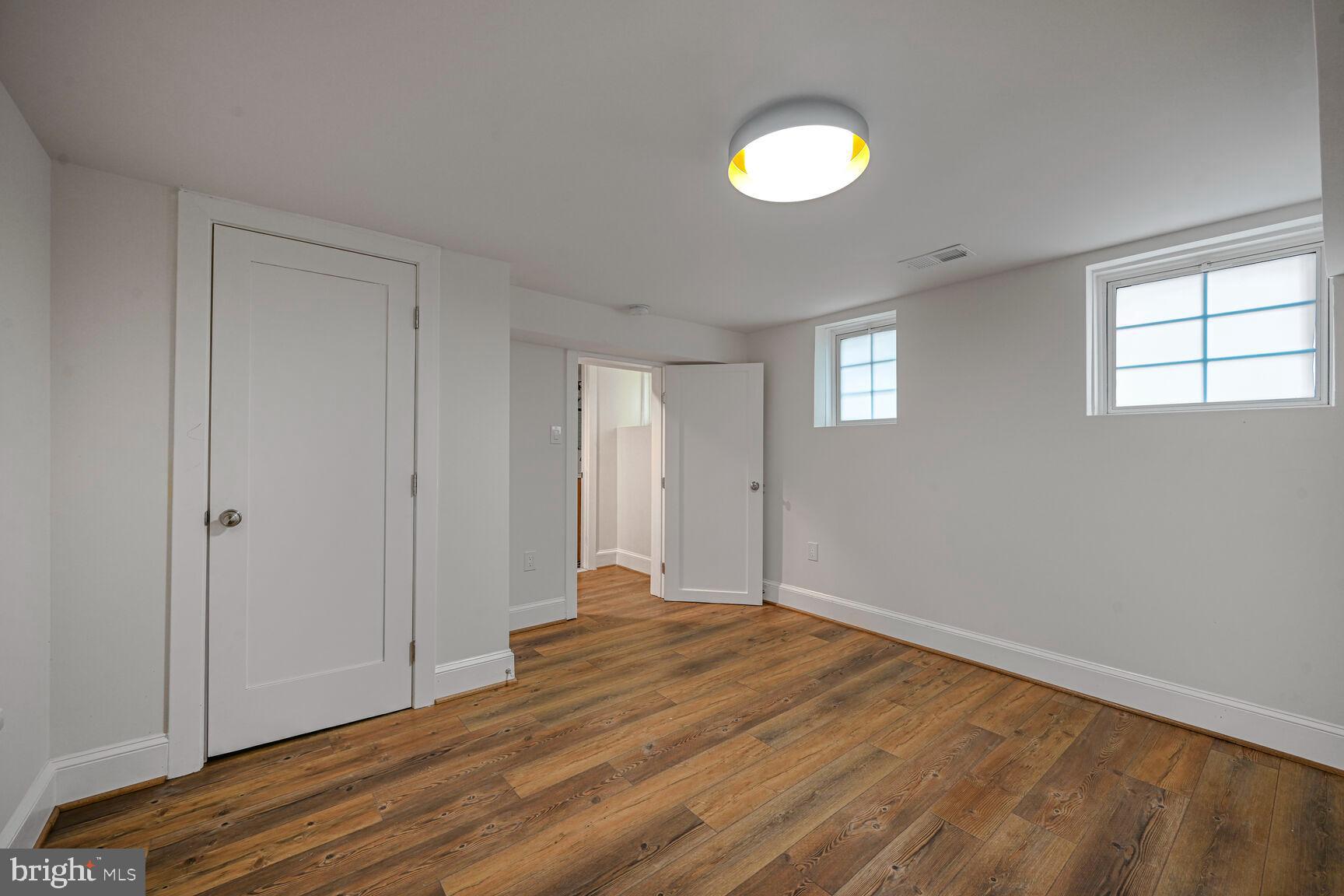 3410 Morrison Street Northwest Washington, DC 20015 - Photo 43 of 71 a view of empty room with wooden floor and fan
