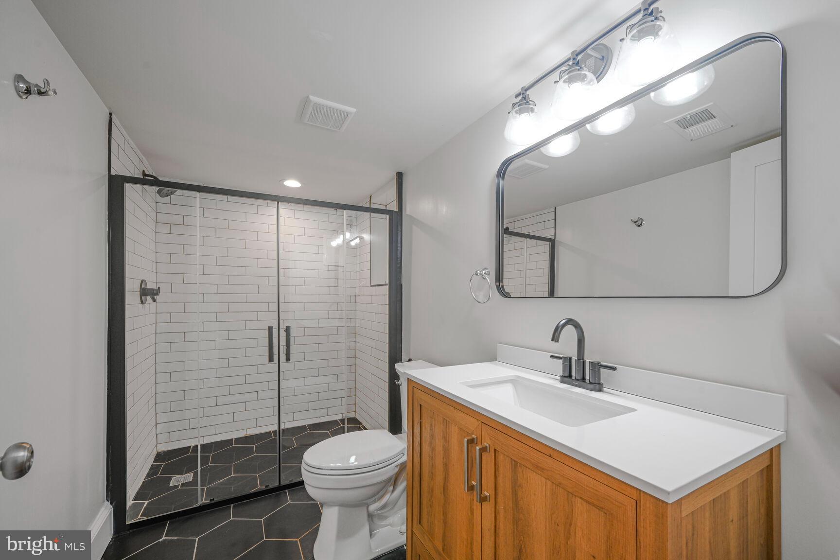 3410 Morrison Street Northwest Washington, DC 20015 - Photo 45 of 71 a bathroom with a sink toilet and shower