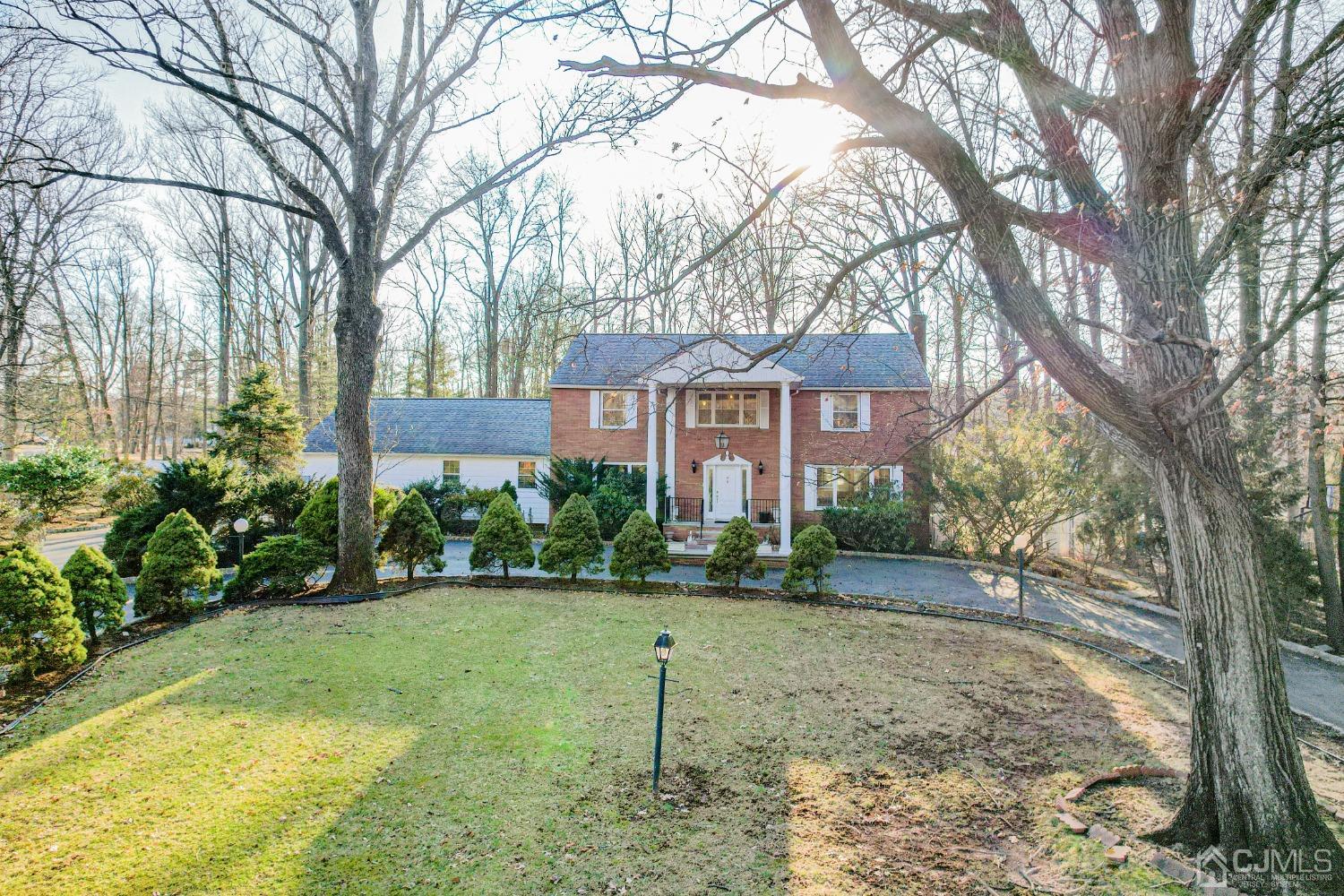 80 Sherwood Road Colonia, NJ 07067 - Photo 1 of 51 a view of a big yard next to a house