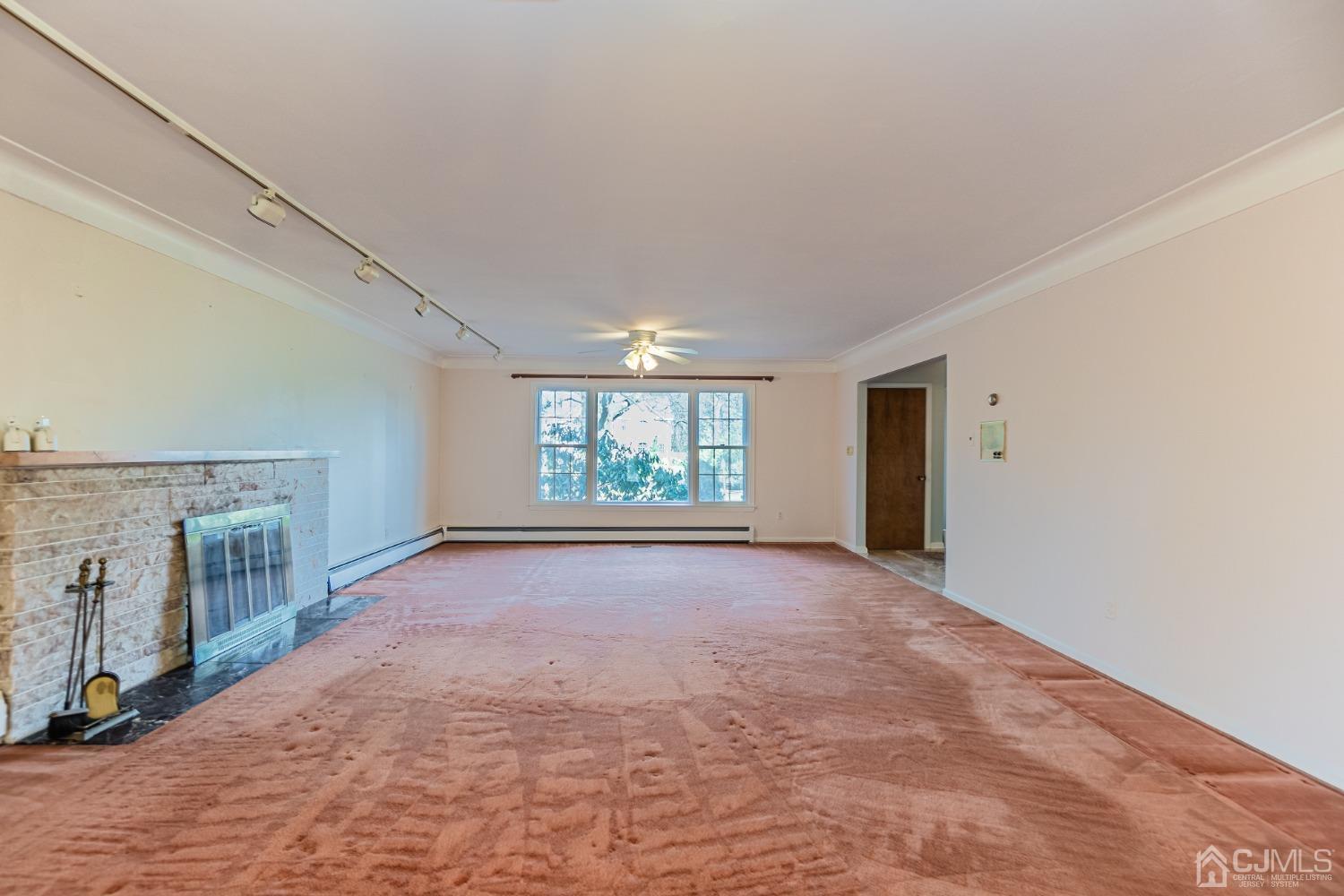 80 Sherwood Road Colonia, NJ 07067 - Photo 13 of 51 an empty room with windows