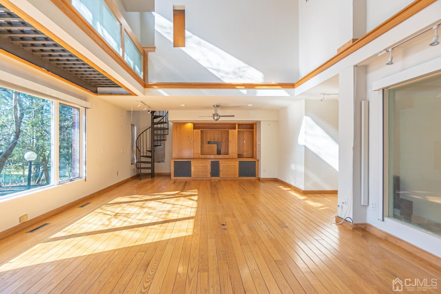 80 Sherwood Road Colonia, NJ 07067 - Photo 15 of 51 a view of empty room with wooden floor and fan