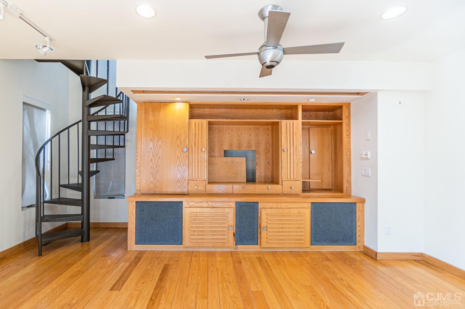 80 Sherwood Road Colonia, NJ 07067 - Photo 18 of 51 a view of a room with wooden floor and staircase