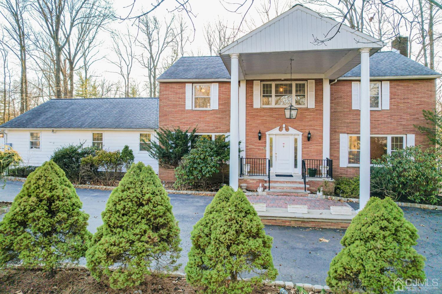 80 Sherwood Road Colonia, NJ 07067 - Photo 2 of 51 front view of a house with a yard