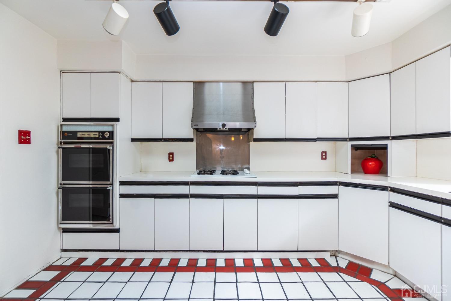 80 Sherwood Road Colonia, NJ 07067 - Photo 21 of 51 a kitchen with stainless steel appliances granite countertop a refrigerator and a stove top oven