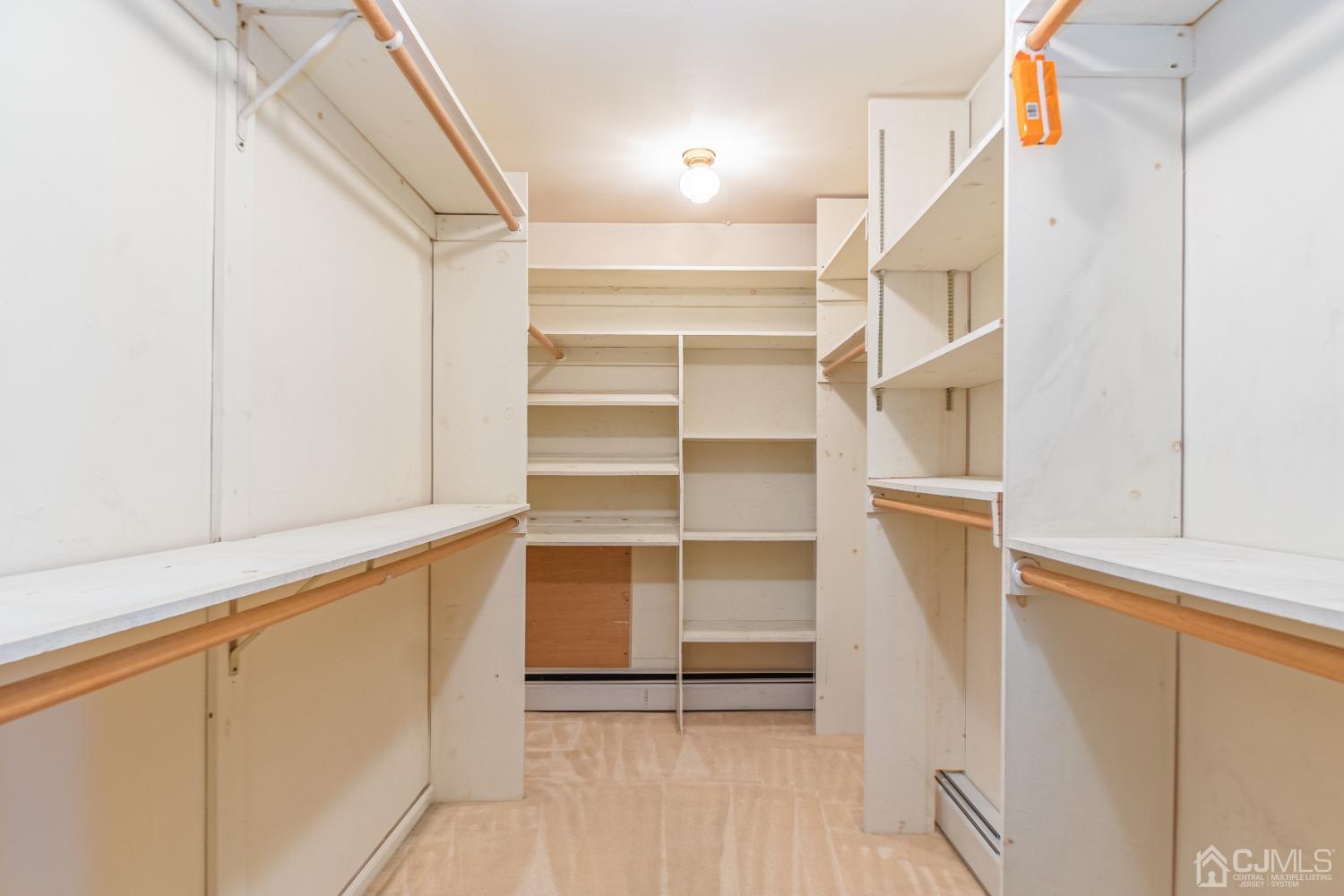 80 Sherwood Road Colonia, NJ 07067 - Photo 29 of 51 a view of walk in closet with empty racks