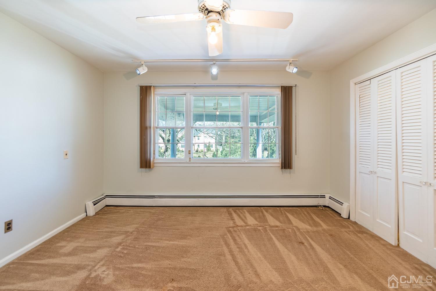 80 Sherwood Road Colonia, NJ 07067 - Photo 33 of 51 an empty room with a window