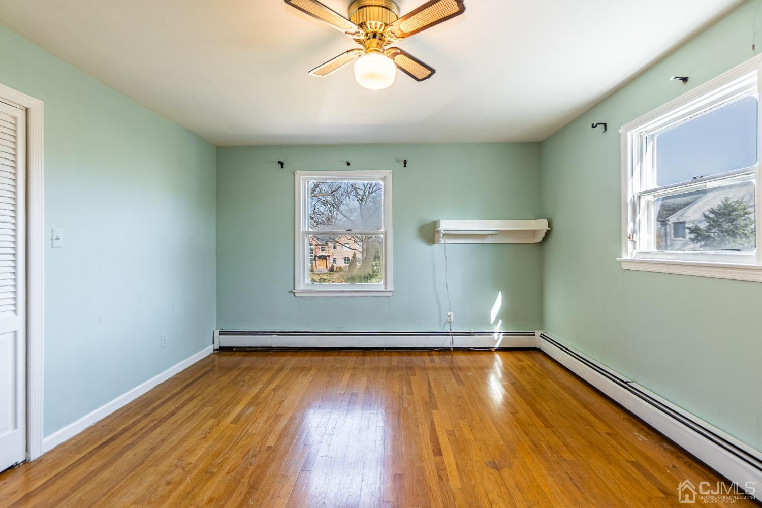 80 Sherwood Road Colonia, NJ 07067 - Photo 37 of 51 a view of room with window and wooden floor