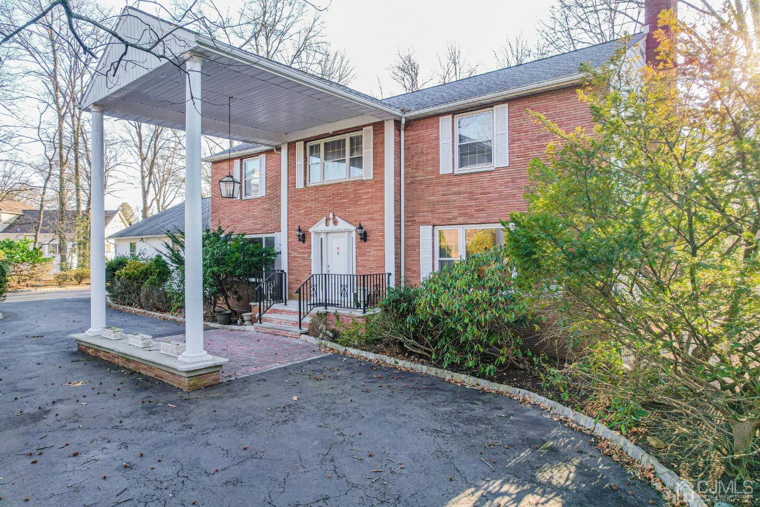 80 Sherwood Road Colonia, NJ 07067 - Photo 4 of 51 a view of a house with backyard and garden