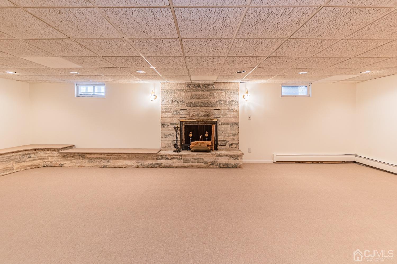 80 Sherwood Road Colonia, NJ 07067 - Photo 45 of 51 a view of an empty room with window and fire place