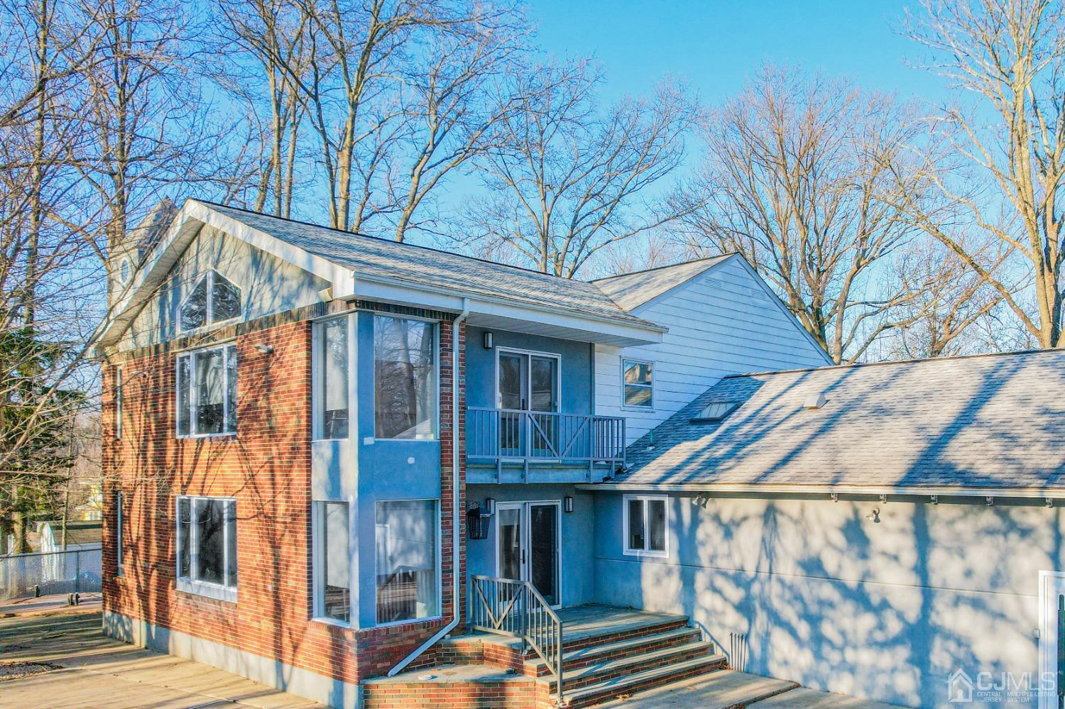 80 Sherwood Road Colonia, NJ 07067 - Photo 6 of 51 a view of a house with a roof deck