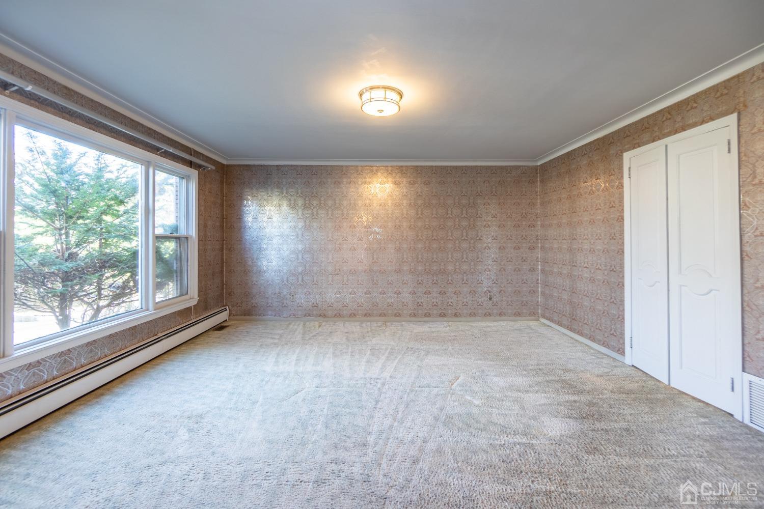 80 Sherwood Road Colonia, NJ 07067 - Photo 10 of 51 an empty room with a empty space and windows