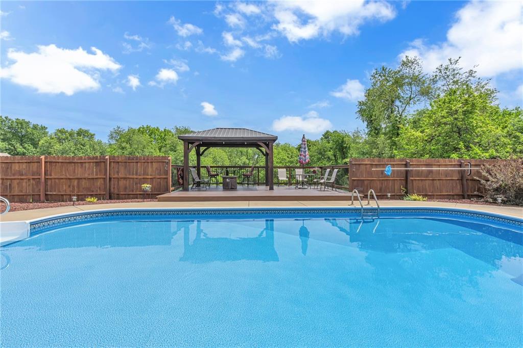 303 Sharon Grange Road Aliquippa, PA 15001 - Photo 38 of 50 Great picture of pool and covered seating area. Nice deck off the concrete area for seating and enjoying dinner or a fire in your fire pit.