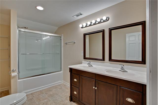 1030 North Sumner Road Portland, TN 37148 - Photo 14 of 20 The master bathroom with NEW double vanity and bath/shower. (Note the height of the ceilings upstairs - high and spacious!)