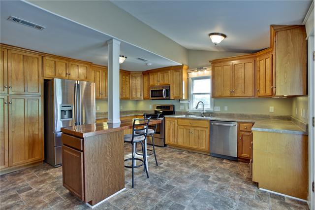 1030 North Sumner Road Portland, TN 37148 - Photo 10 of 20 This kitchen as it all. Lots of cabinetry, counter space, island, walk-in pantry, and NEW stainless appliances!