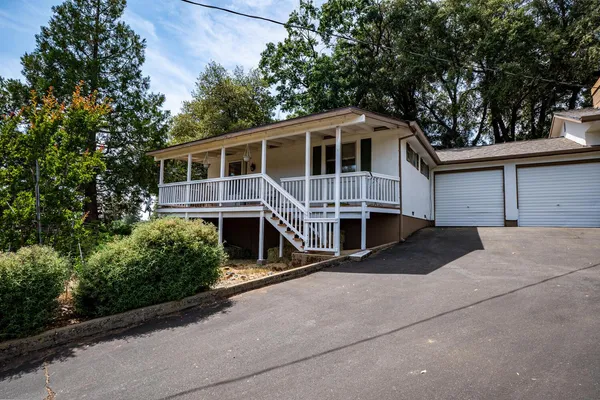 a view of a livingroom with furniture and a window