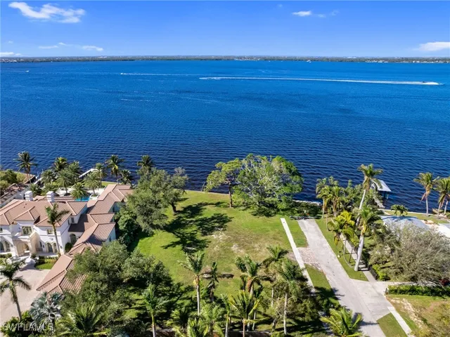 a view of a lake with a big yard