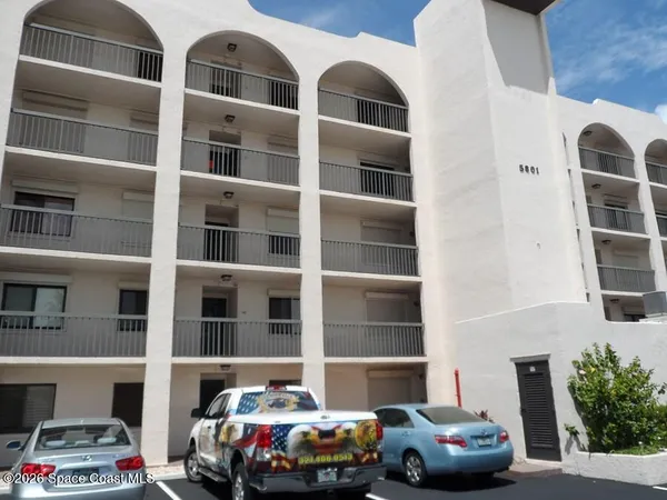 a cars parked in front of a building