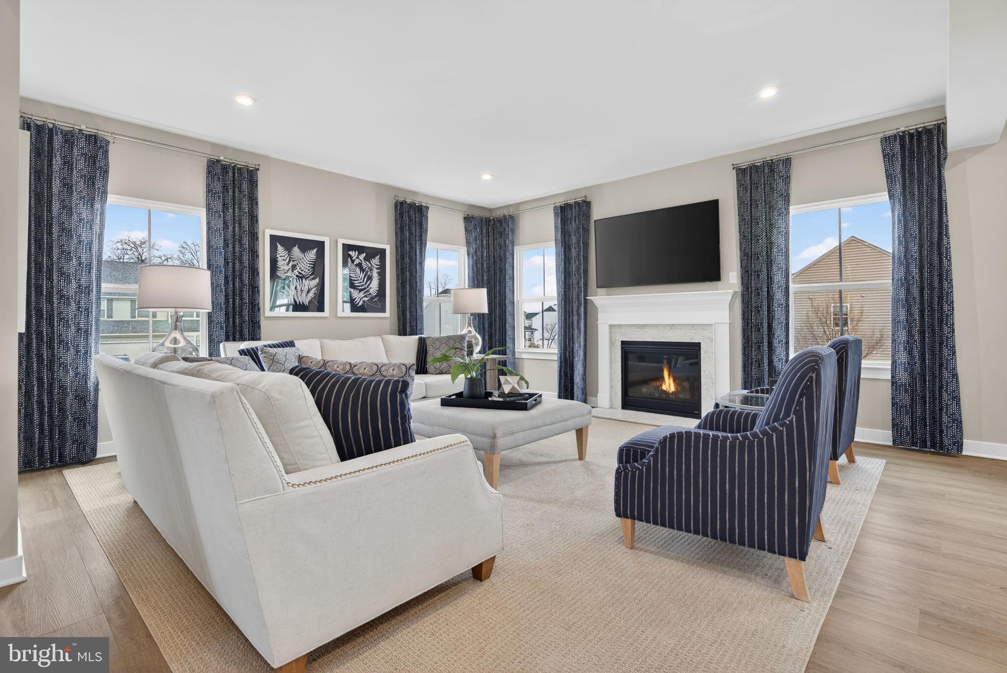 3575 Wildview Lane York, PA 17404 - Photo 18 of 62 a living room with furniture fireplace and a flat screen tv