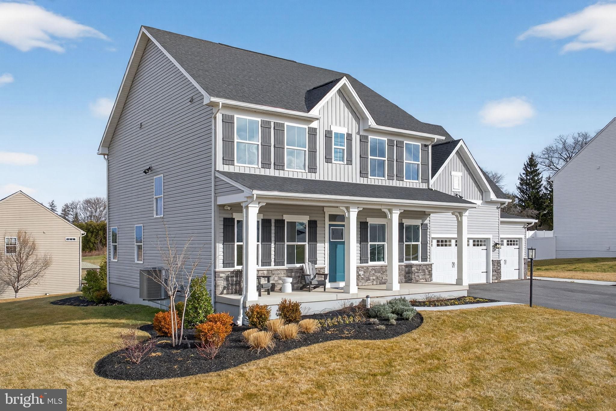 3575 Wildview Lane York, PA 17404 - Photo 2 of 62 a front view of a house with a yard and fountain