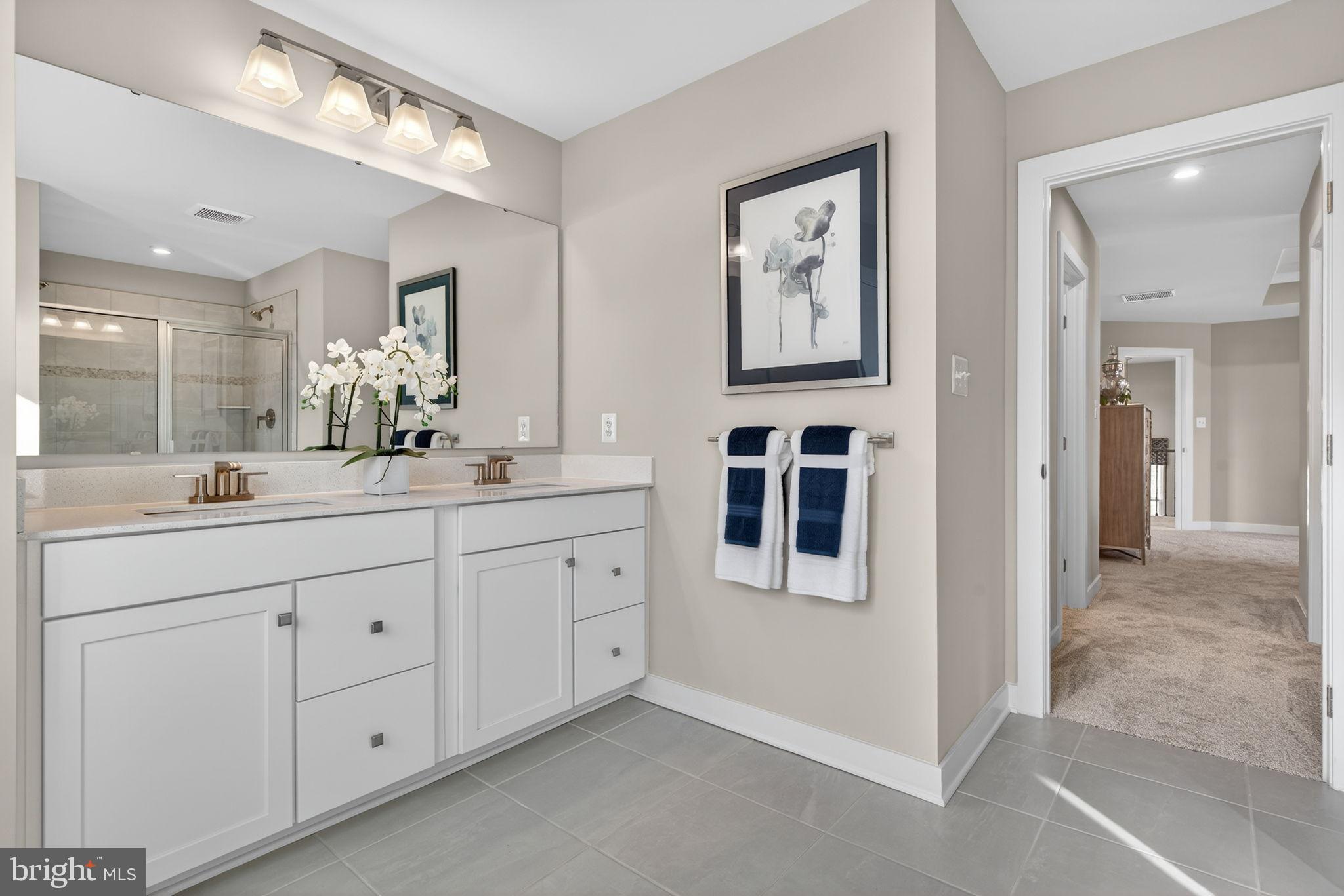 3575 Wildview Lane York, PA 17404 - Photo 36 of 62 a spacious bathroom with a double vanity sink and a mirror