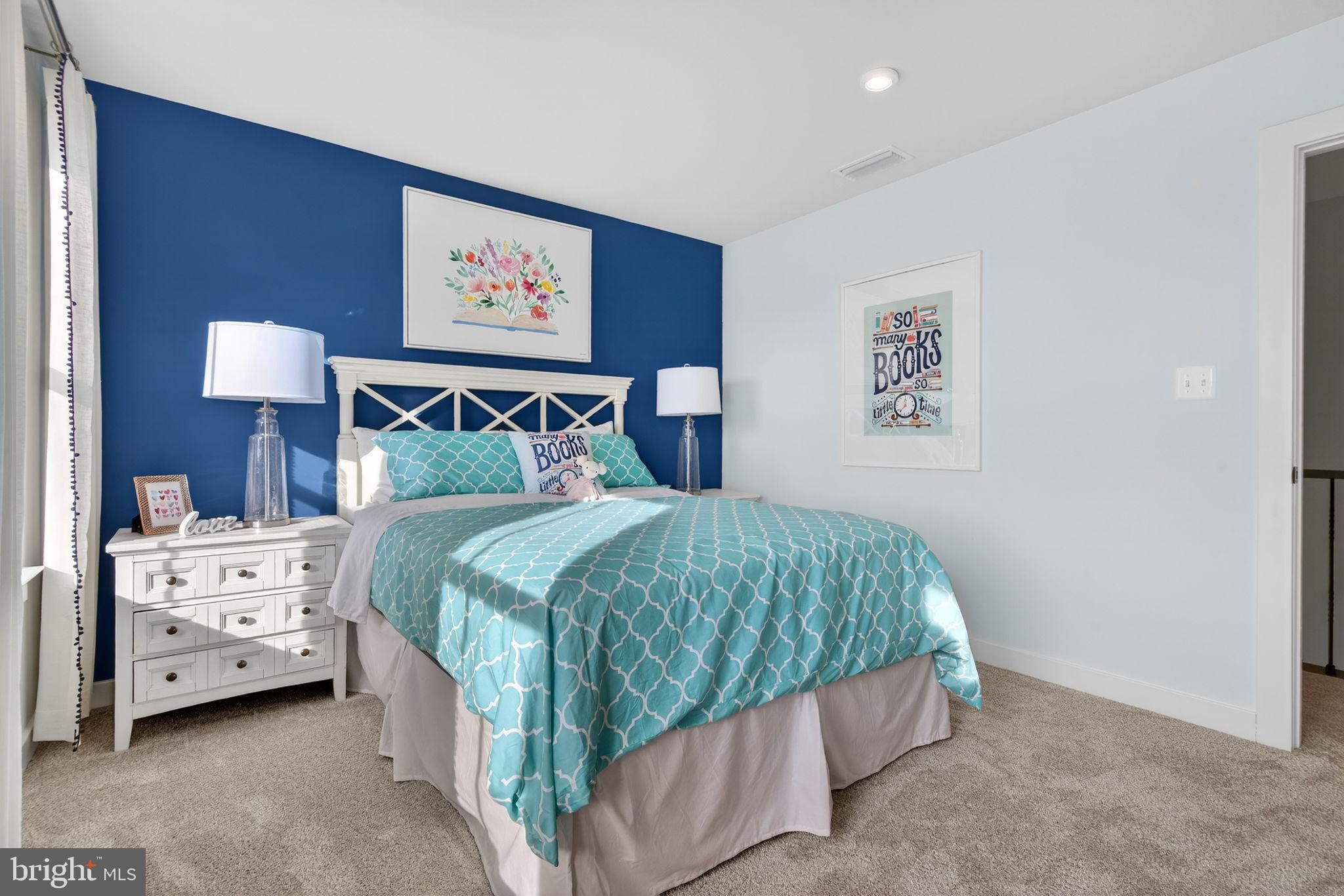 3575 Wildview Lane York, PA 17404 - Photo 40 of 62 a bedroom with a bed and a lamp on dresser