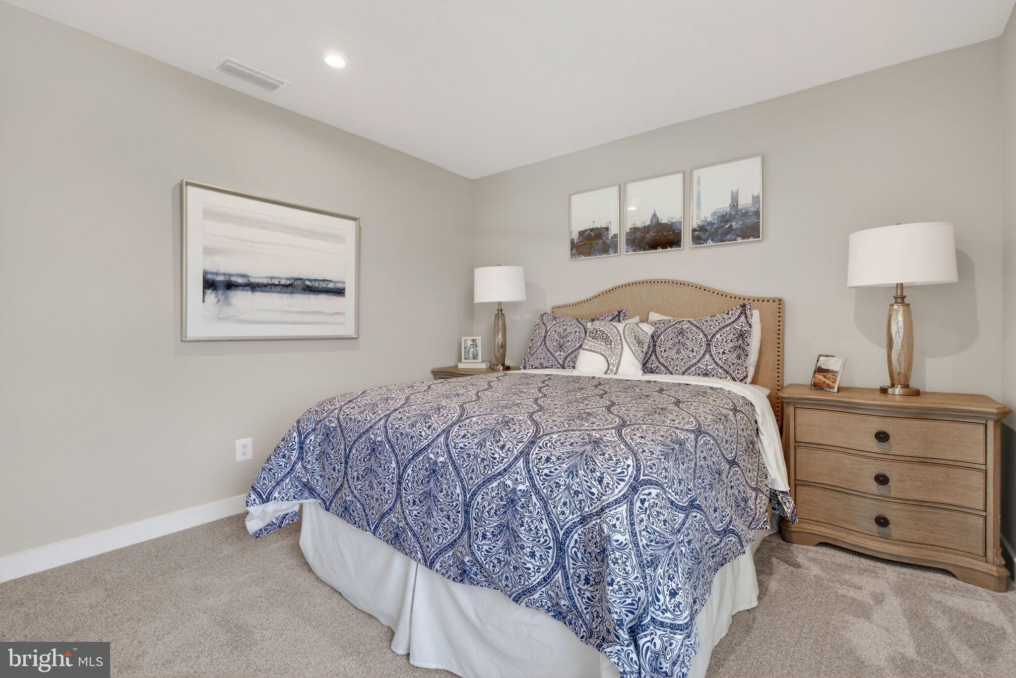 3575 Wildview Lane York, PA 17404 - Photo 46 of 62 a bedroom with a bed and a lamp on dresser