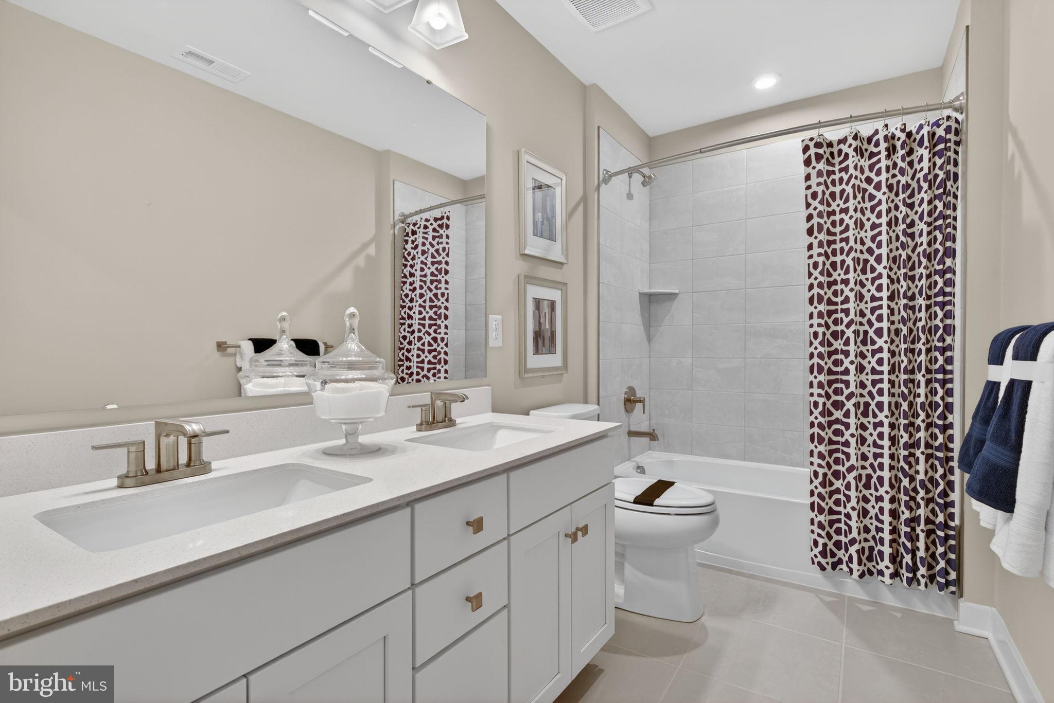 3575 Wildview Lane York, PA 17404 - Photo 48 of 62 a bathroom with a double vanity sink toilet mirror and shower