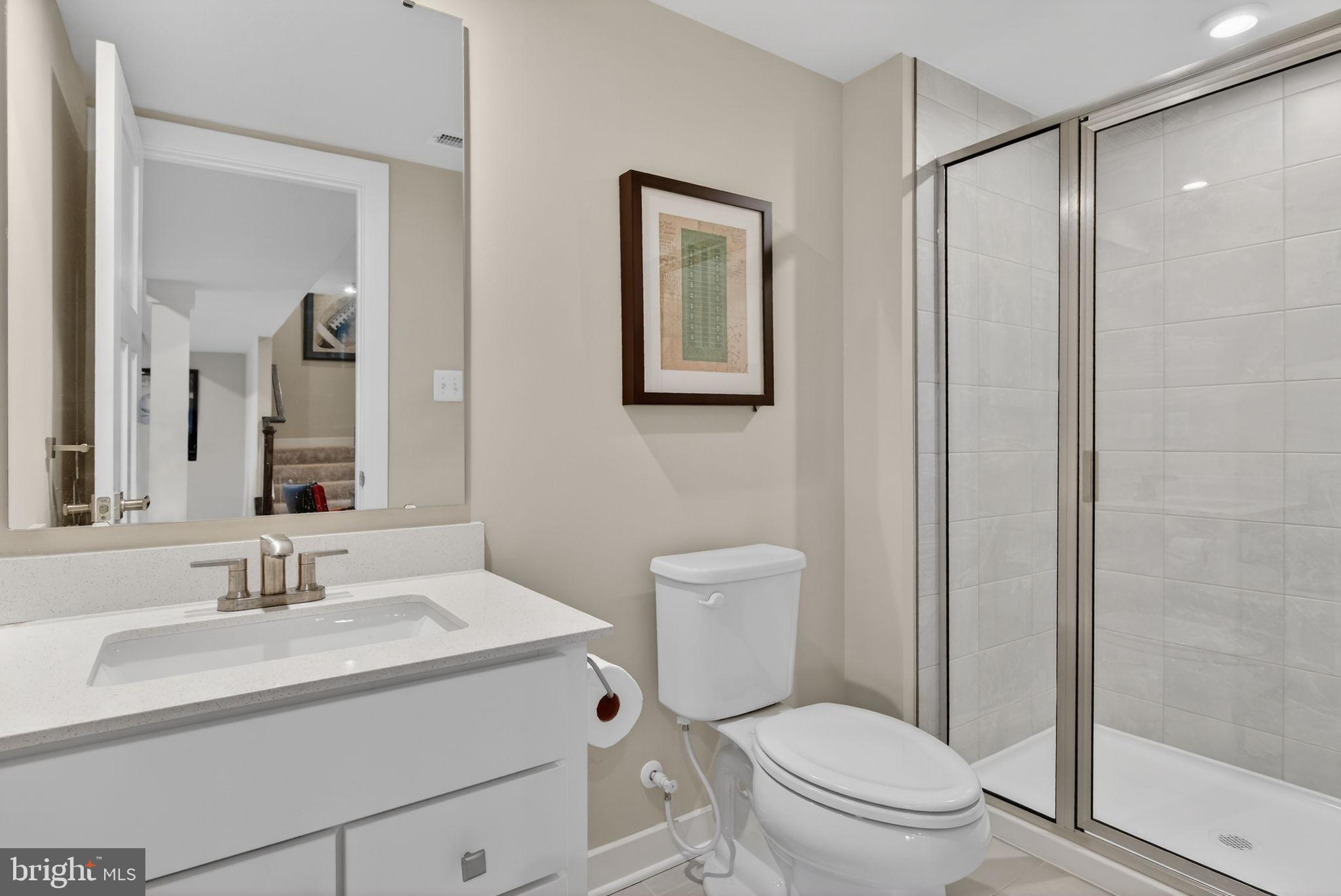 3575 Wildview Lane York, PA 17404 - Photo 59 of 62 a bathroom with a toilet sink vanity and mirror