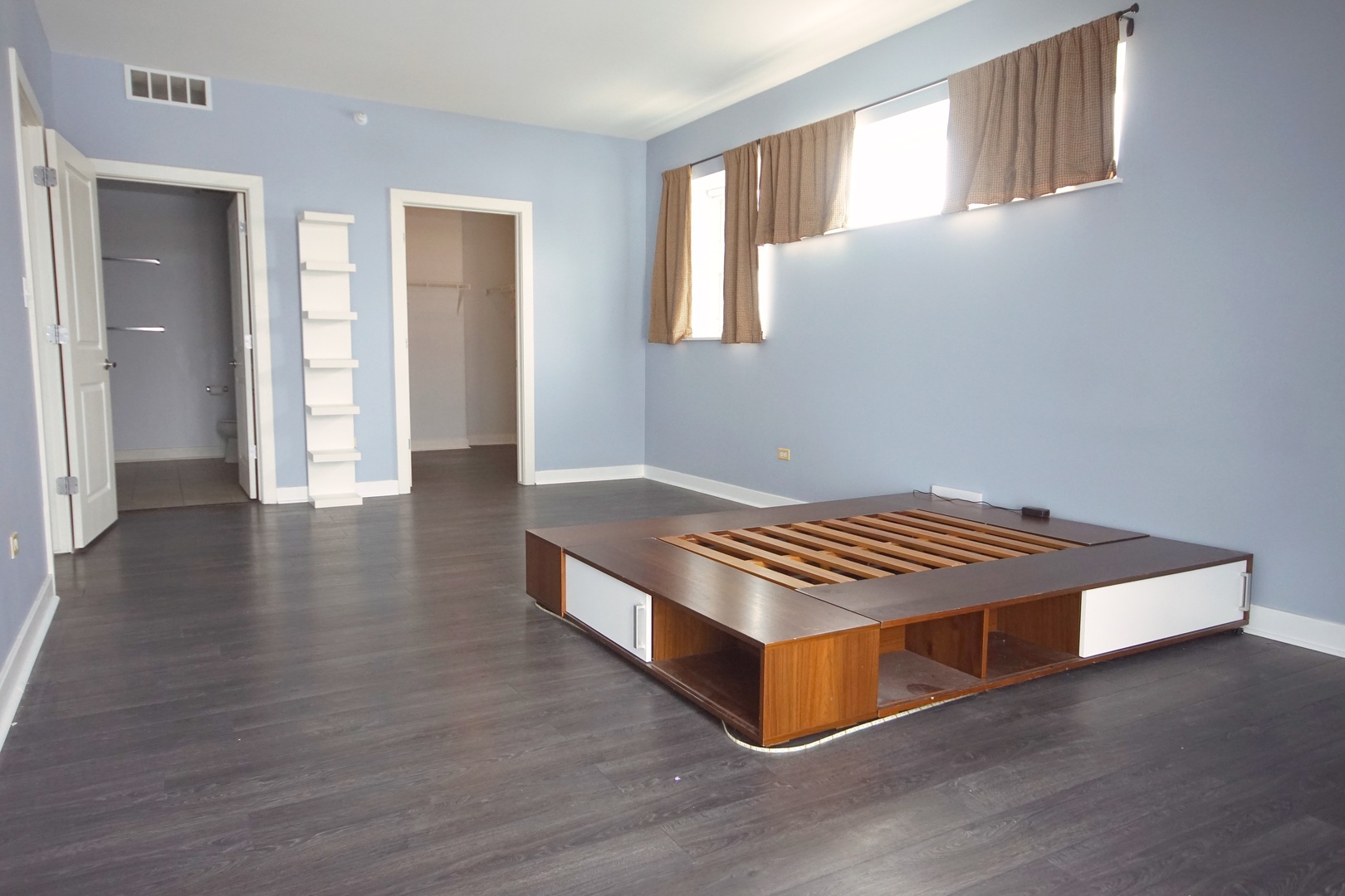 1905 South Wolf Road, Unit 401 Hillside, IL 60162 - Photo 13 of 22 a room with wooden floors and window