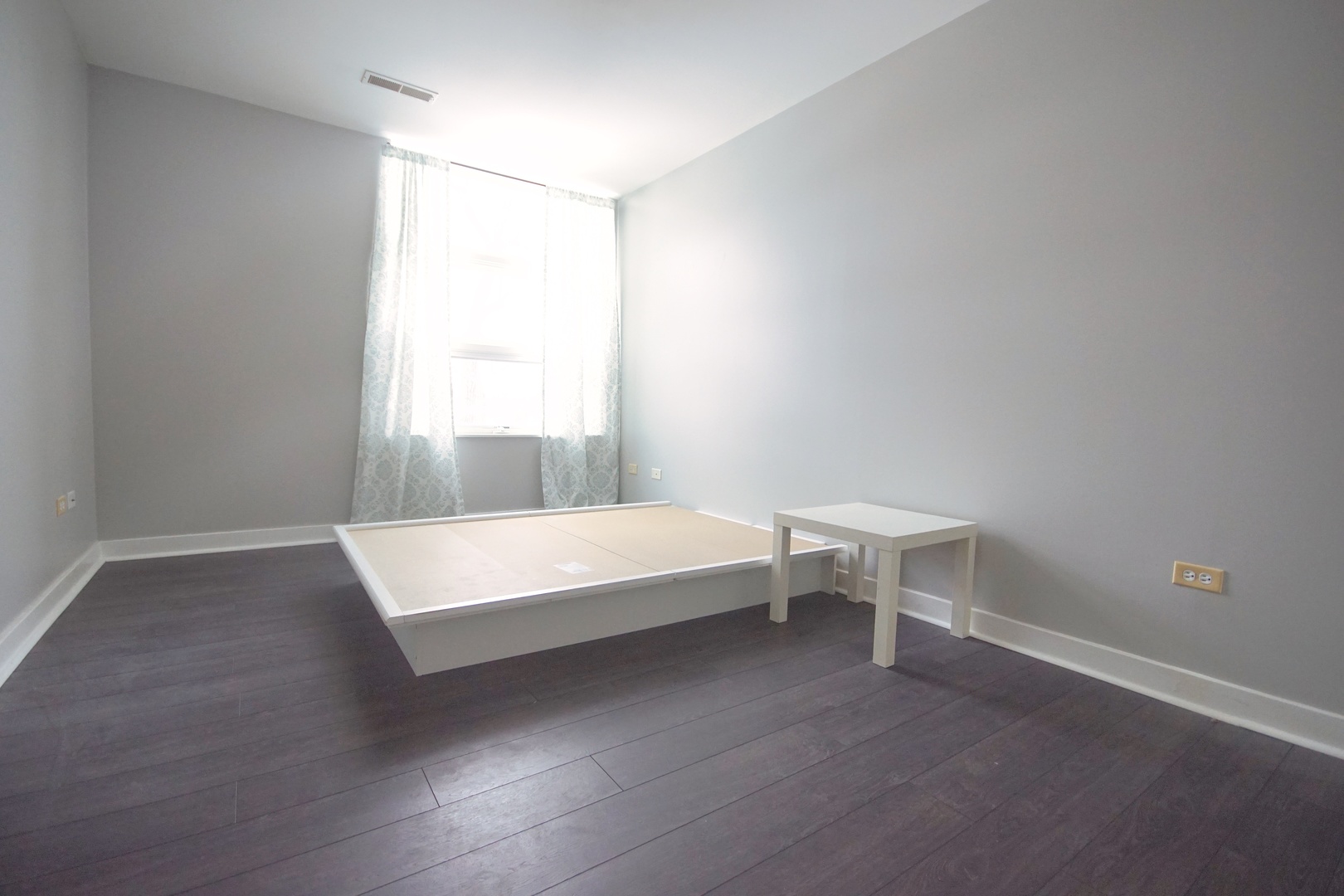 1905 South Wolf Road, Unit 401 Hillside, IL 60162 - Photo 18 of 22 a spacious bedroom with a bed and a table