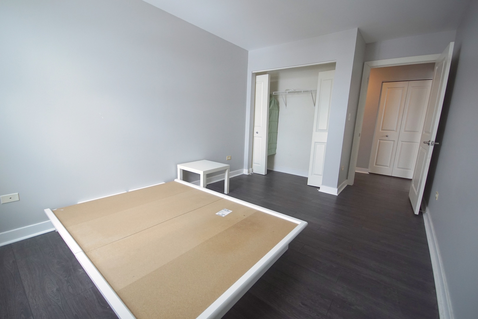 1905 South Wolf Road, Unit 401 Hillside, IL 60162 - Photo 19 of 22 a view of a room that has a bed and a wooden floor
