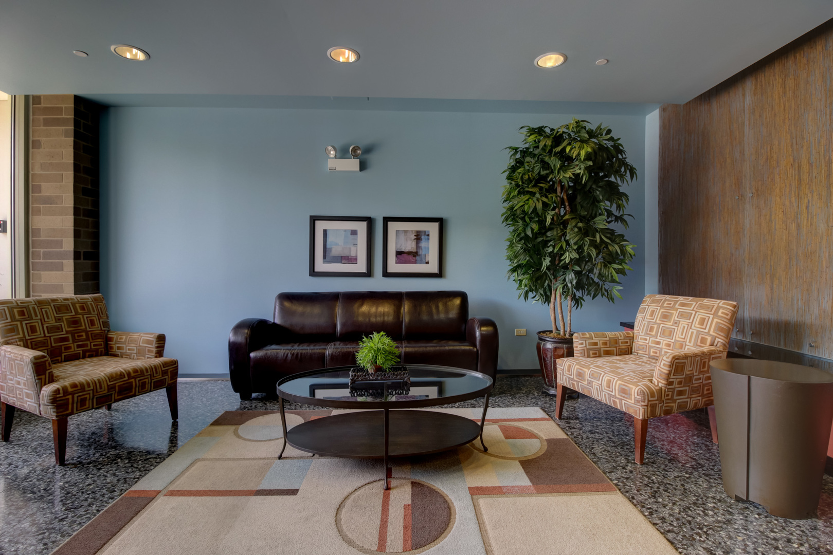 1905 South Wolf Road, Unit 401 Hillside, IL 60162 - Photo 5 of 22 a living room with furniture a potted plant and a lamp